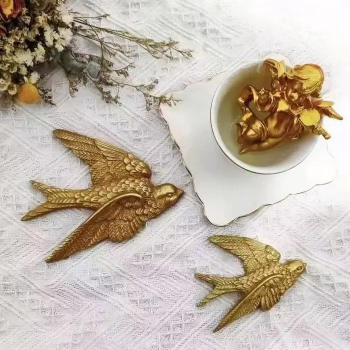 Pendentif mural en forme d'hirondelle