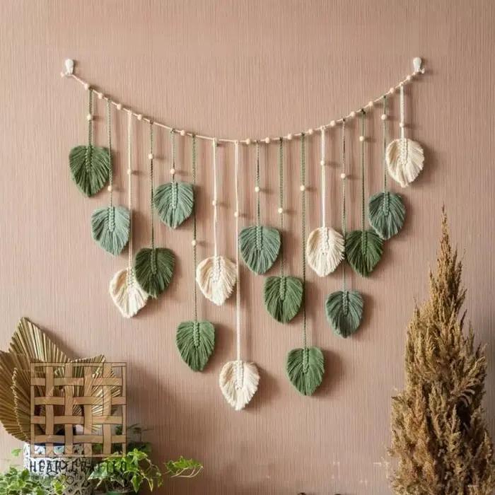 Tapisserie murale bohème 120x75cm, panneau en macramé avec feuilles et pompons, feuille verte, décor